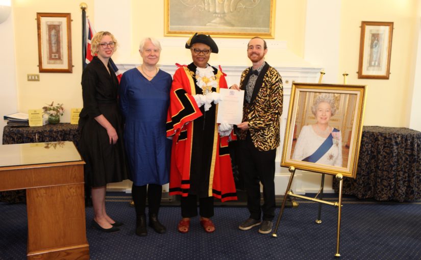 Sonia, Paula, the speake of Tower Hamlets council and me with a photo of the queen