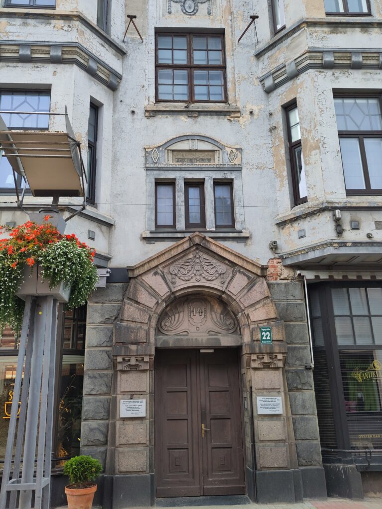 A building that looks like a flat above a shop.
